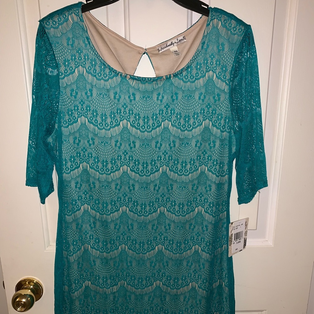 NWT Lace dress. Teal color with tan lining.
